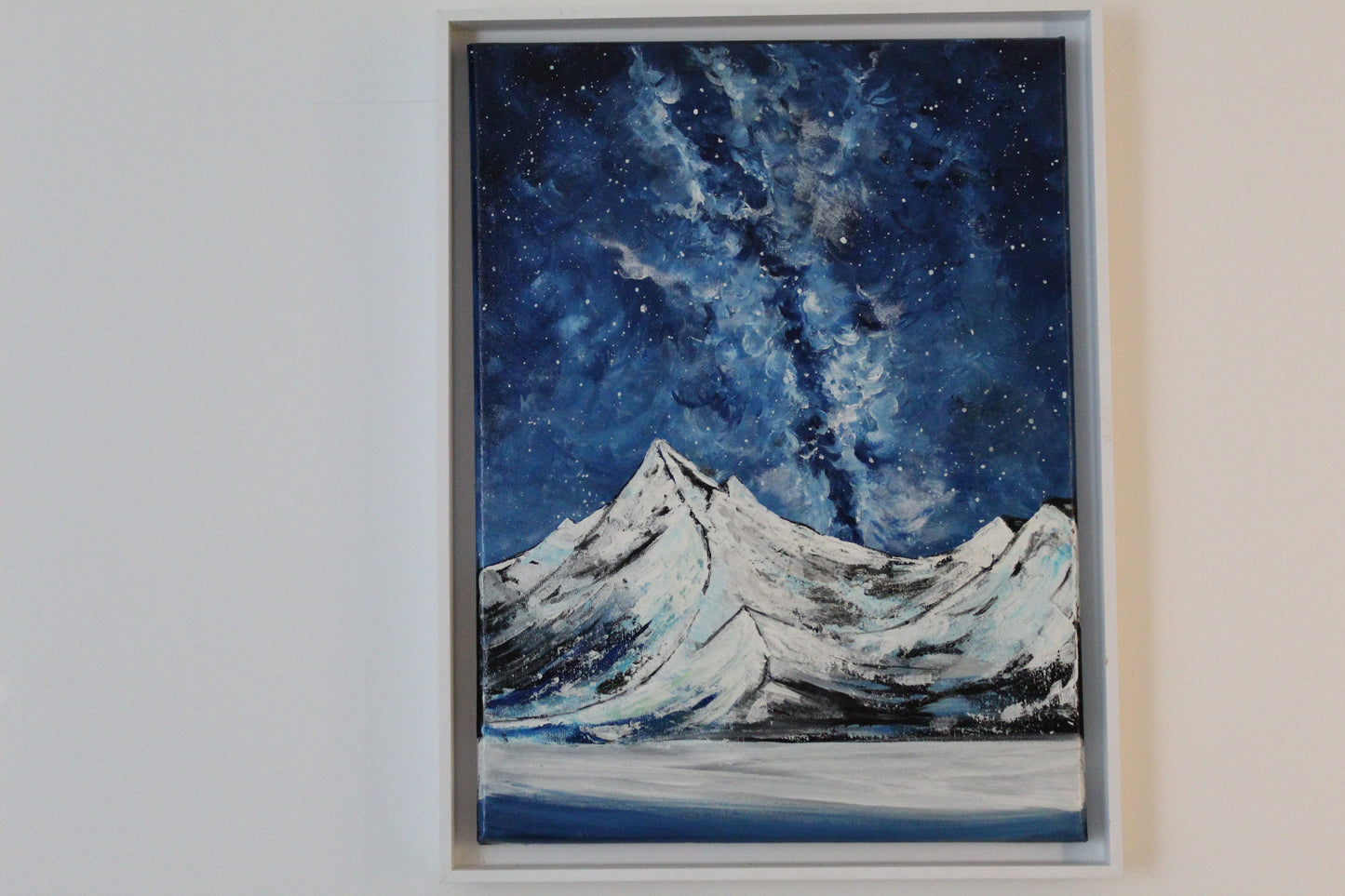 Snony mountain on a milky way night