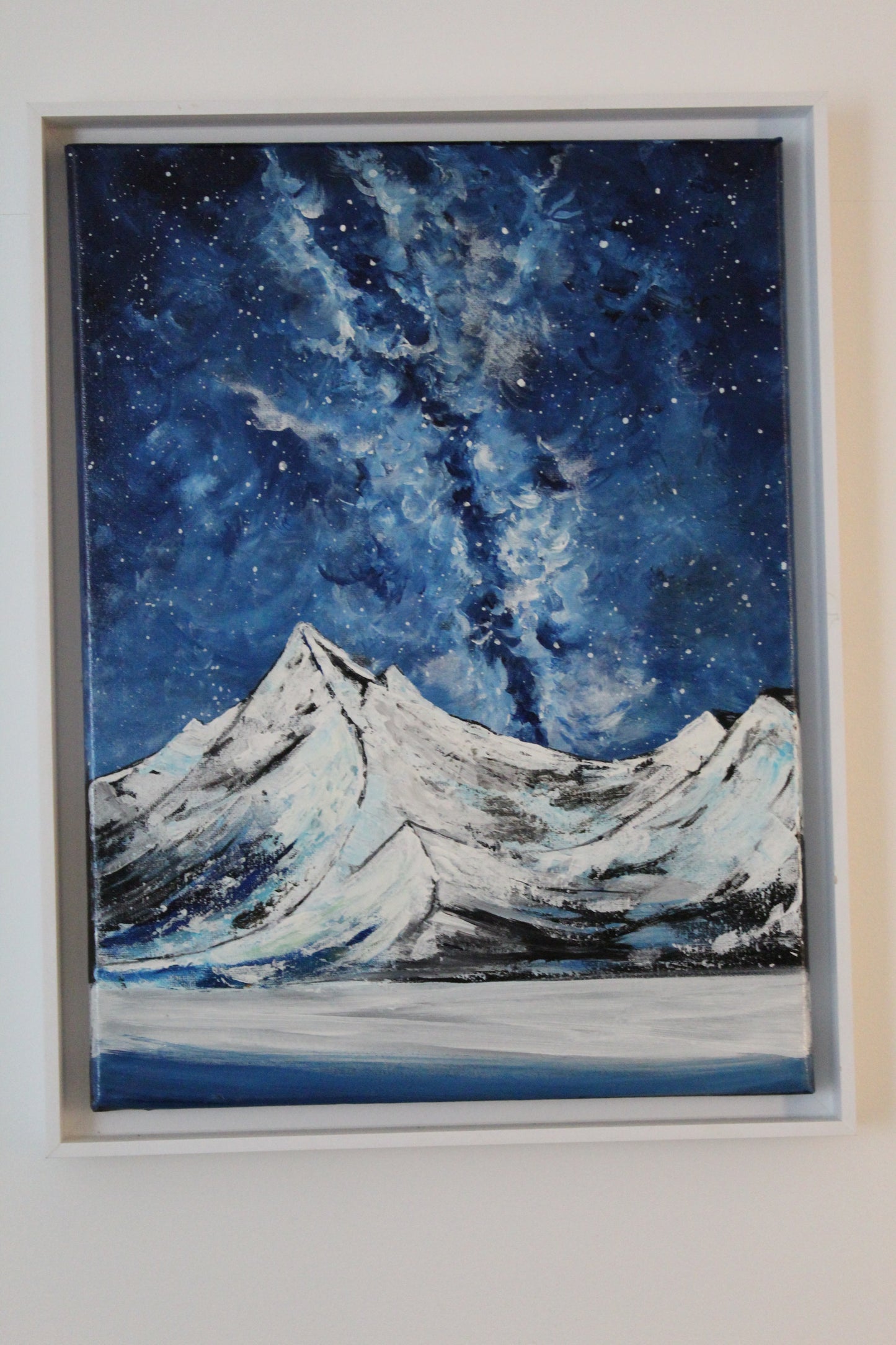 Snony mountain on a milky way night